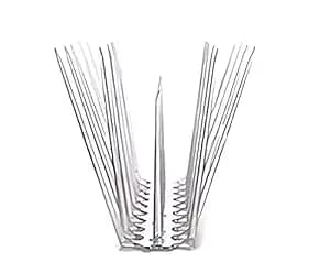 Bird spikes installation on building ledge