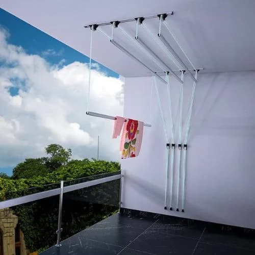 Pulley ceiling cloth hanger over a glass-railing balcony with one rod lowered