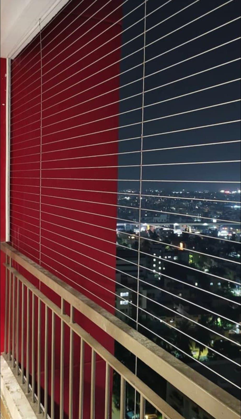 Night balcony invisible grill with city skyline