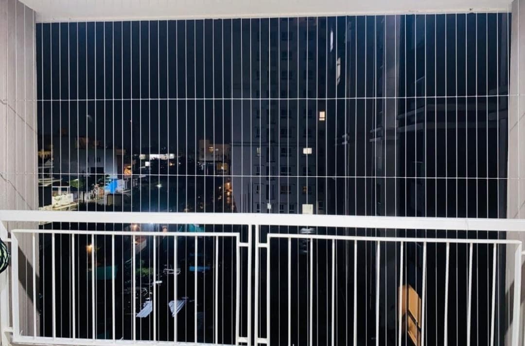 Night balcony invisible grill with city lights