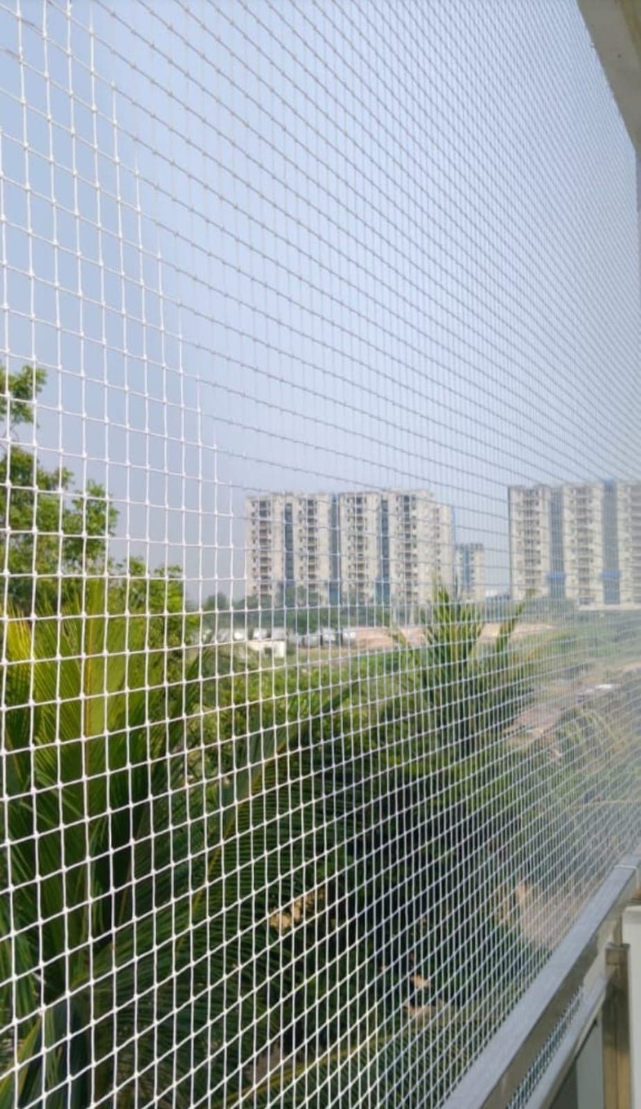 White balcony safety net with apartment view
