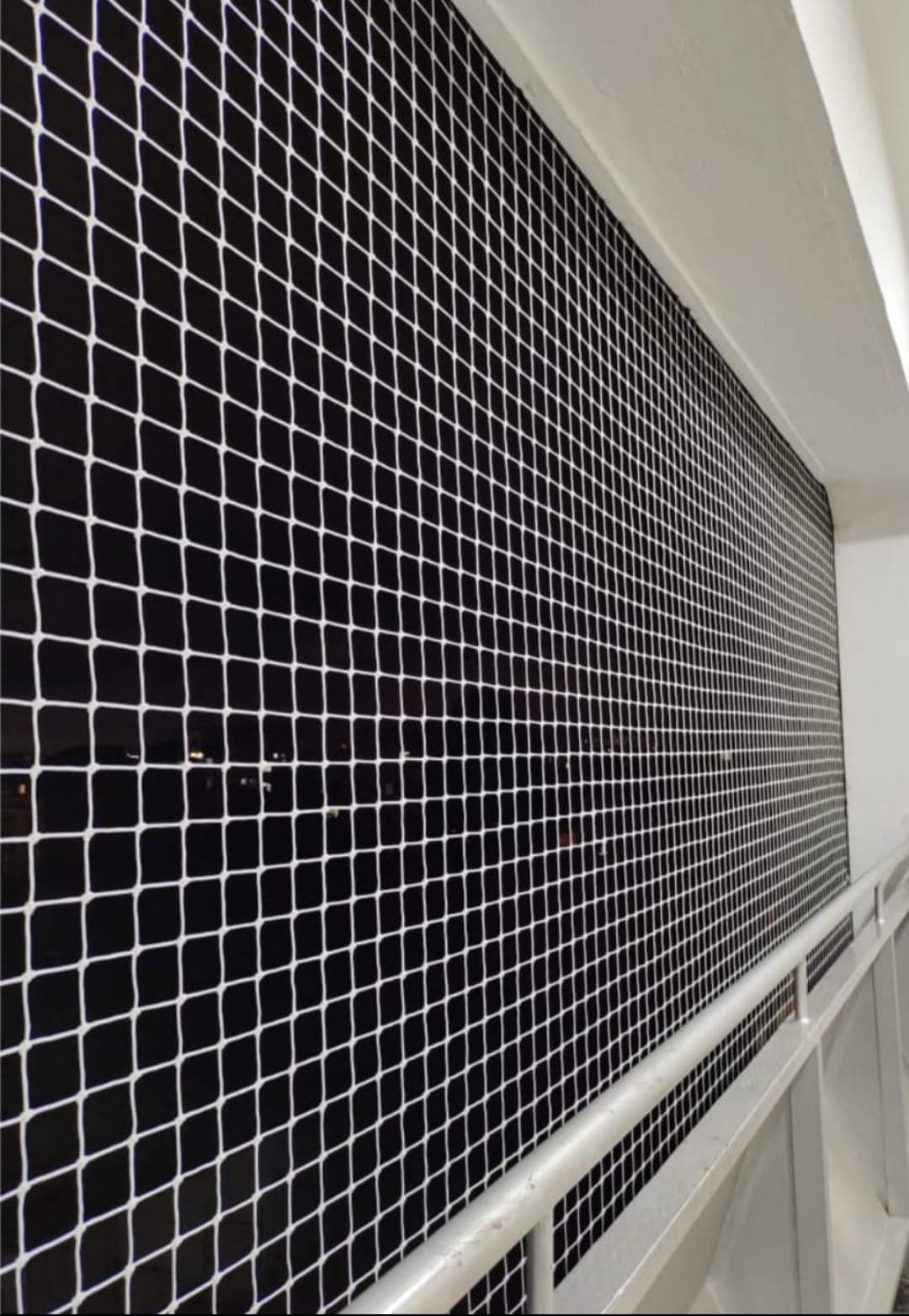 High-rise balcony safety net looking along the opening
