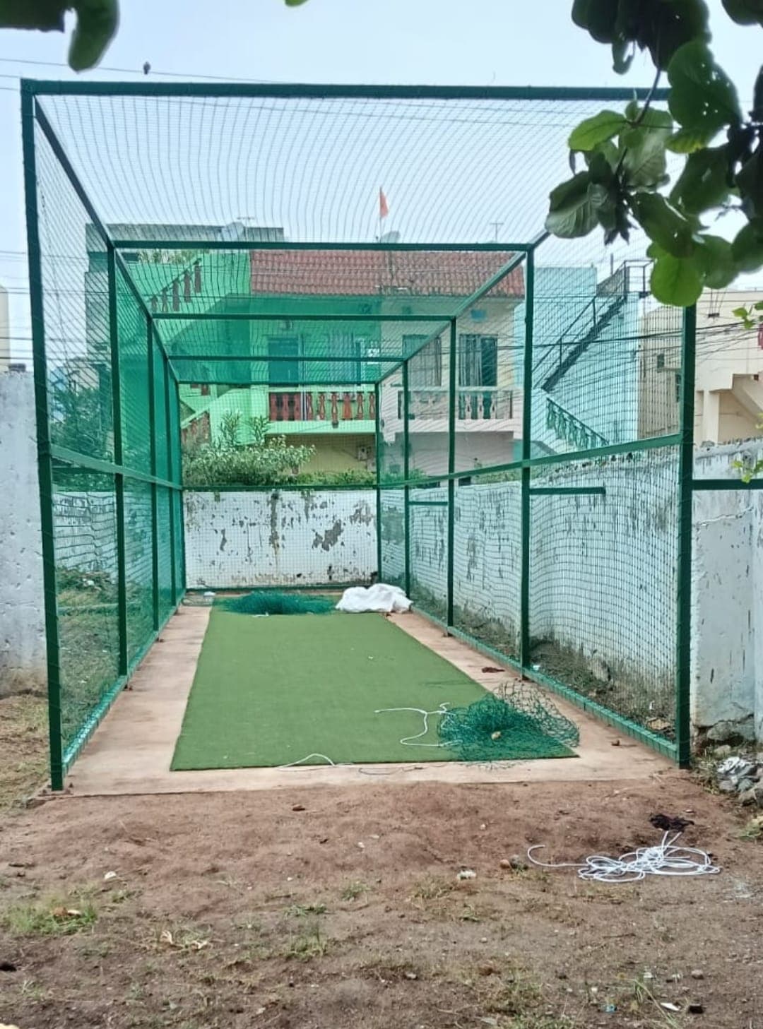 Installer securing green safety netting