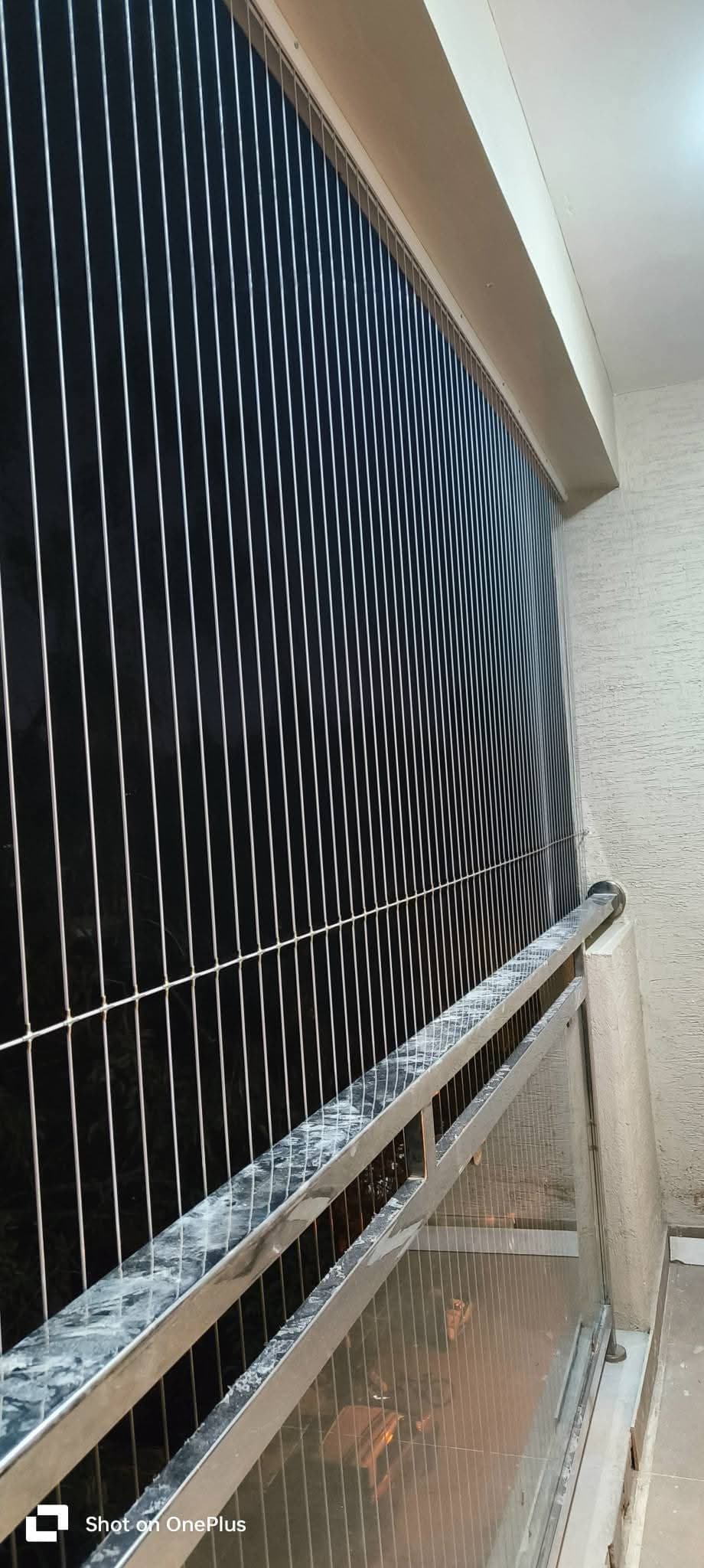 Completed invisible grill on glass balcony railing